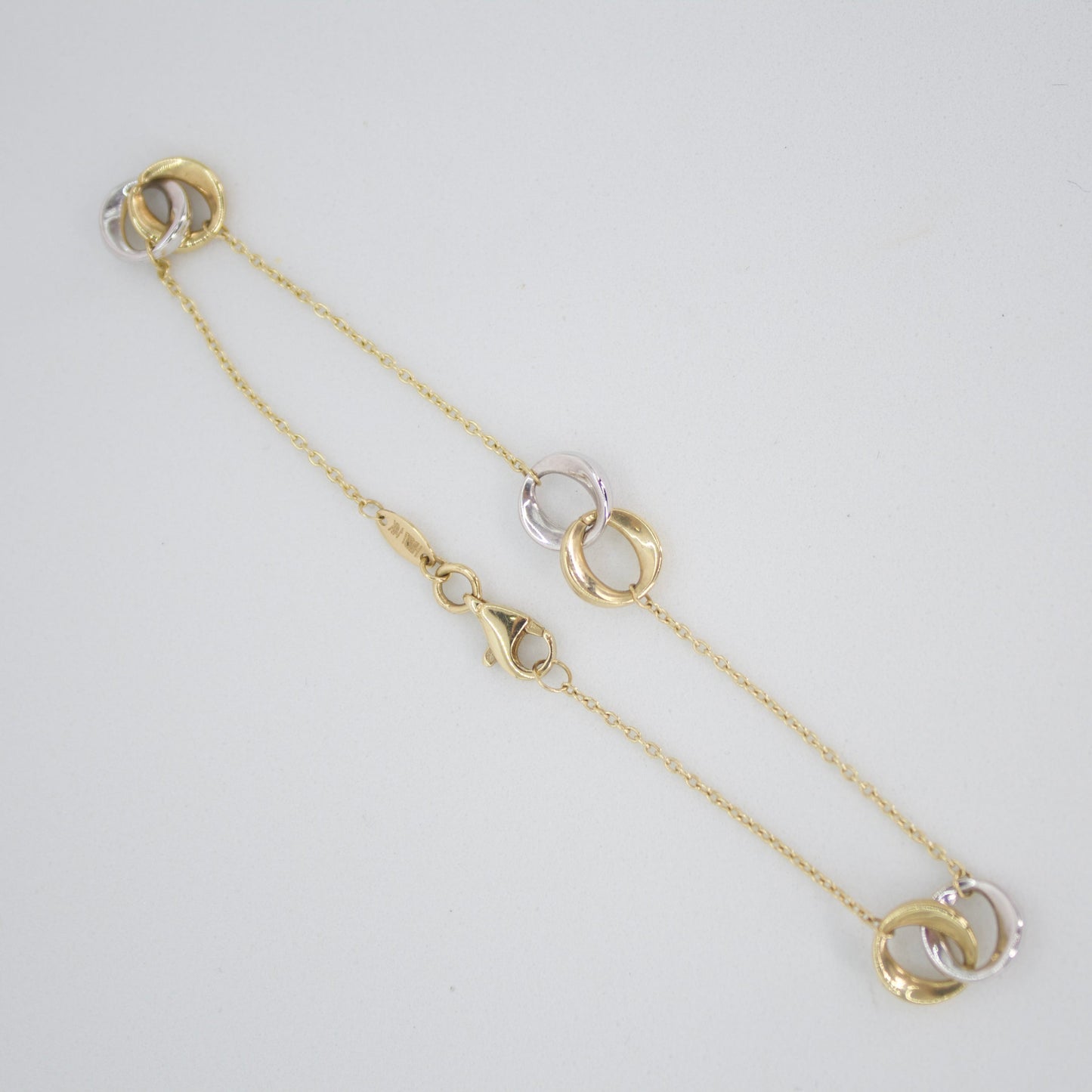 Pulsera doble aro en oro combinado 14k.