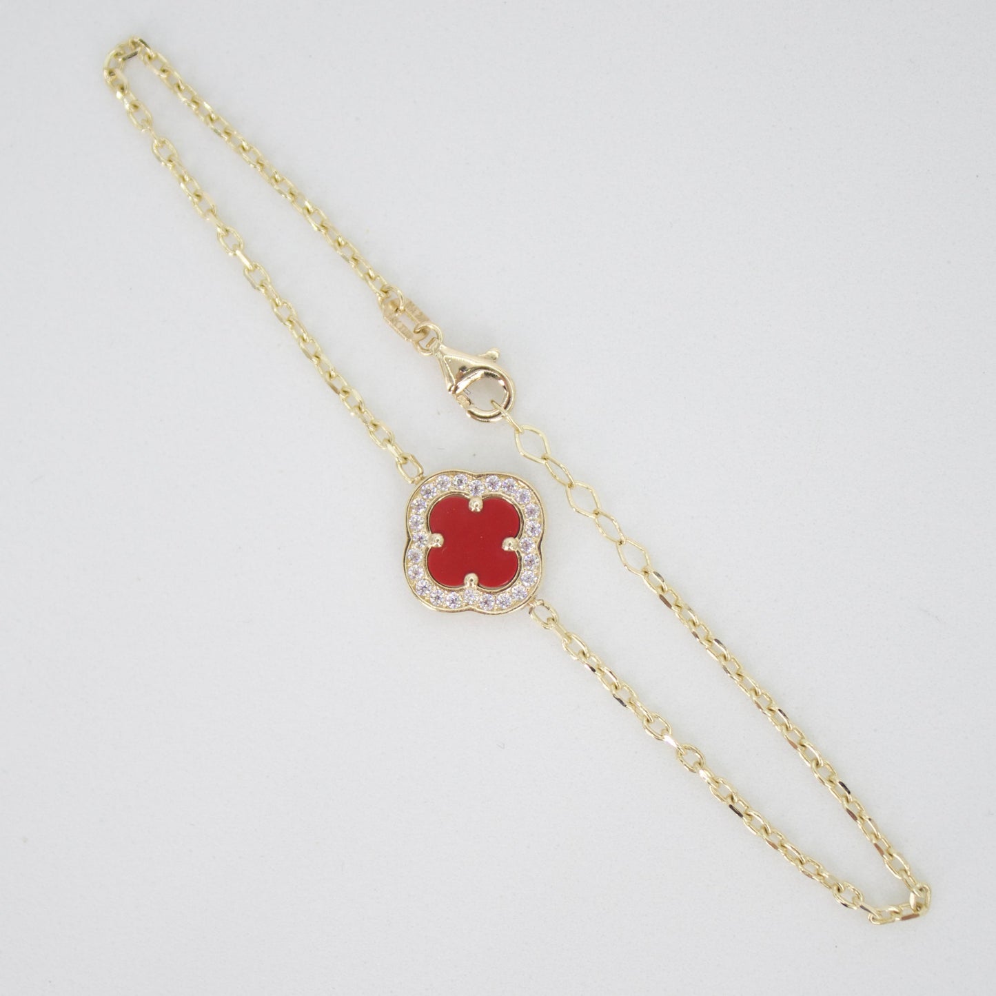 Pulsera trébol oro amarillo 14k con coral y zirconias .