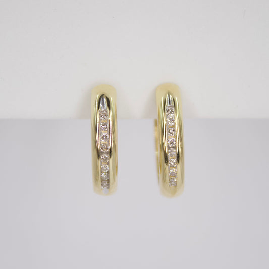 Arracadas en oro amarillo 14k con diamantes.