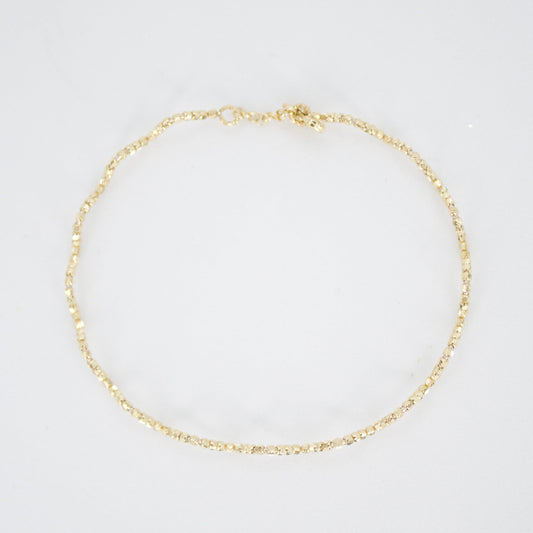 Pulsera rígida de bolitas en oro amarillo 14k.