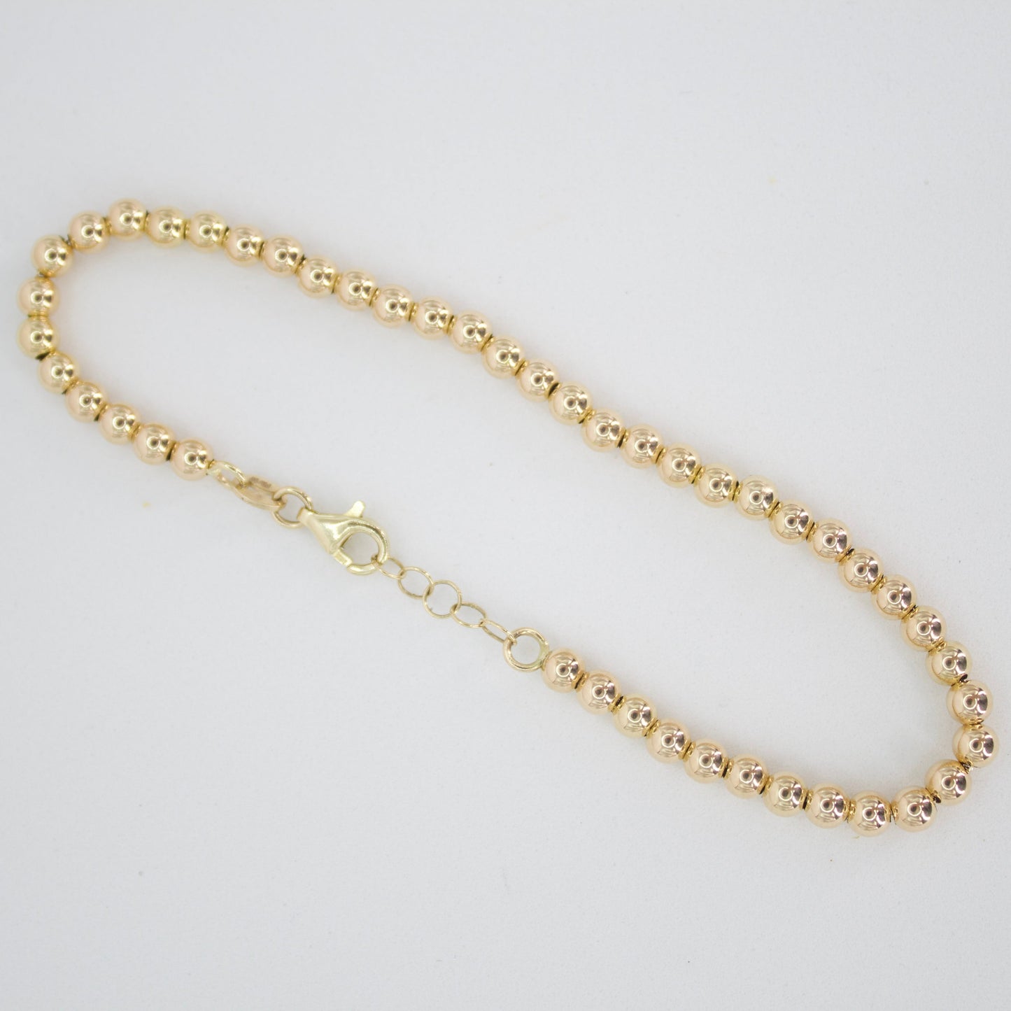 Pulsera de bolitas en oro amarillo 14k.