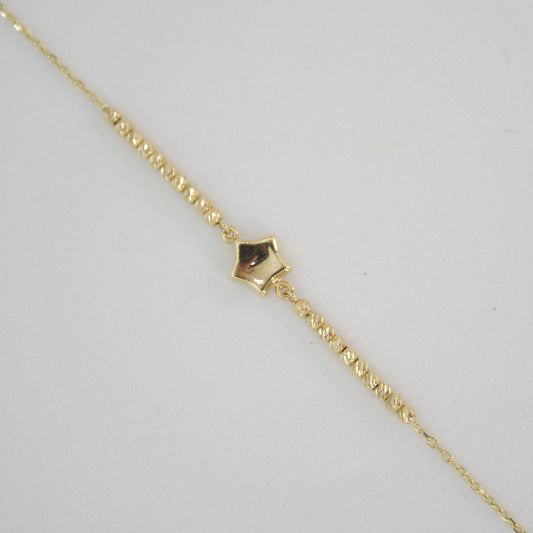 Pulsera en oro amarillo 14k con estrella.