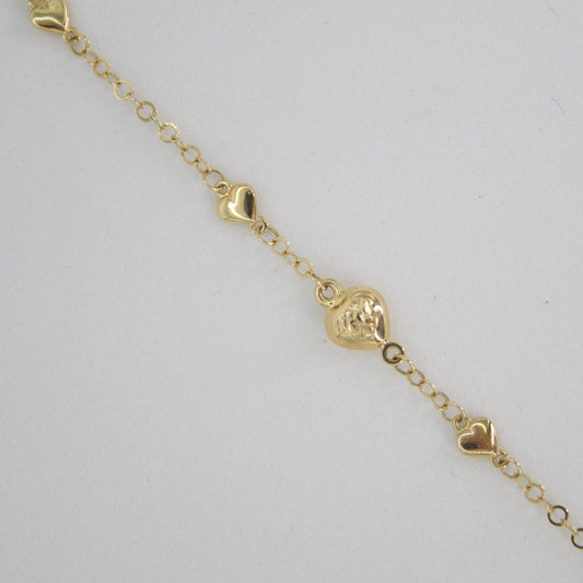 Pulsera de corazones en oro amarillo 14k.