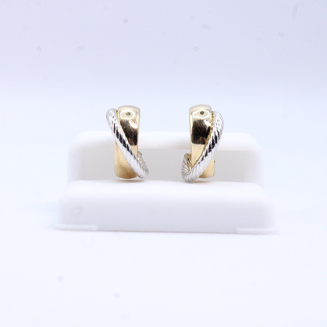 Aretes huggies en oro combinado 14k