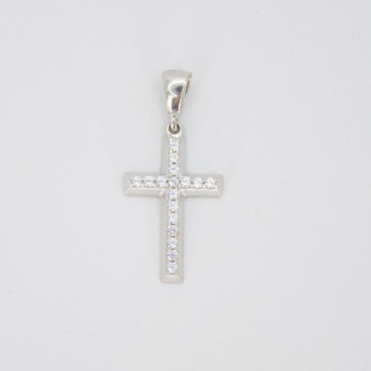 Cruz en oro blanco 14k con zirconias.