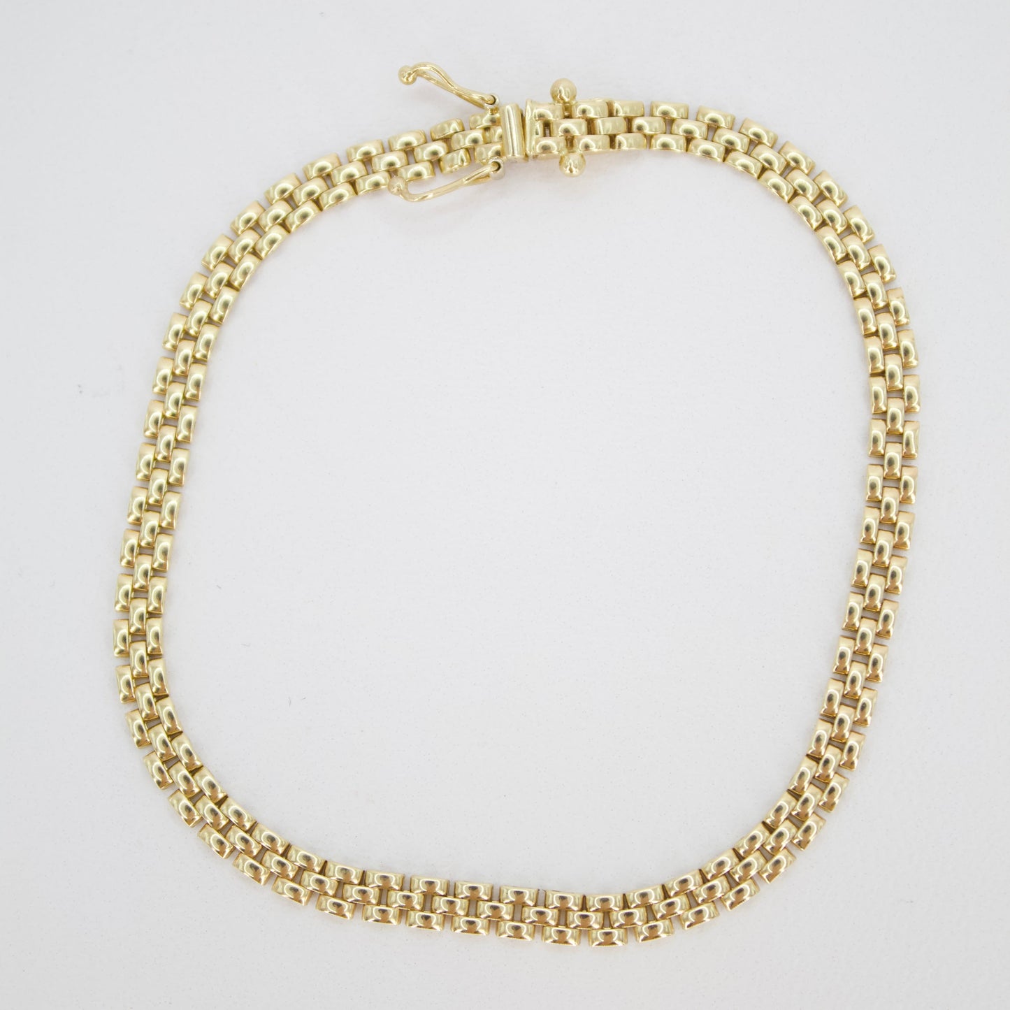 Pulsera tejido pantera en oro amarillo 14k.