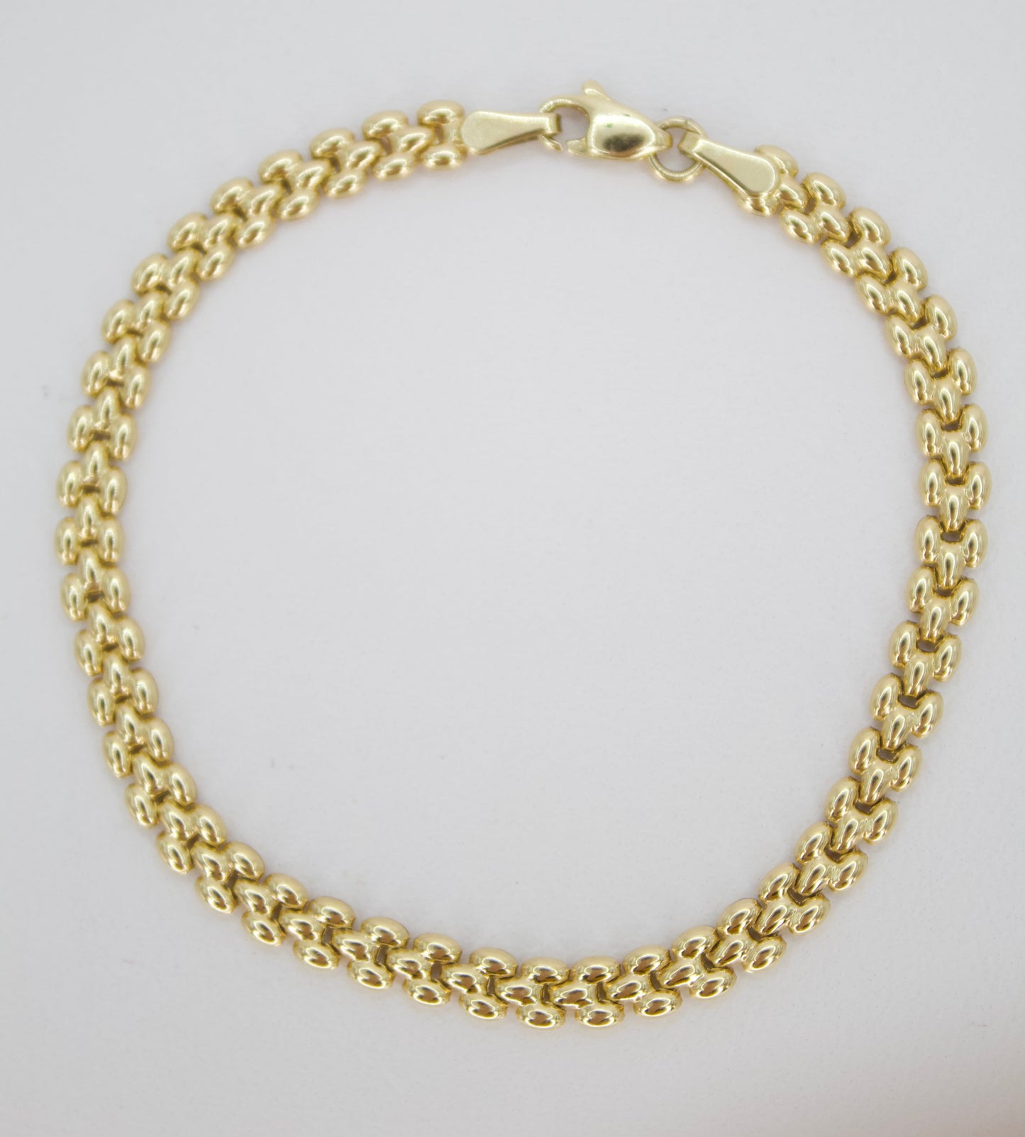 Pulsera tejido pantera en oro amarillo 14k.