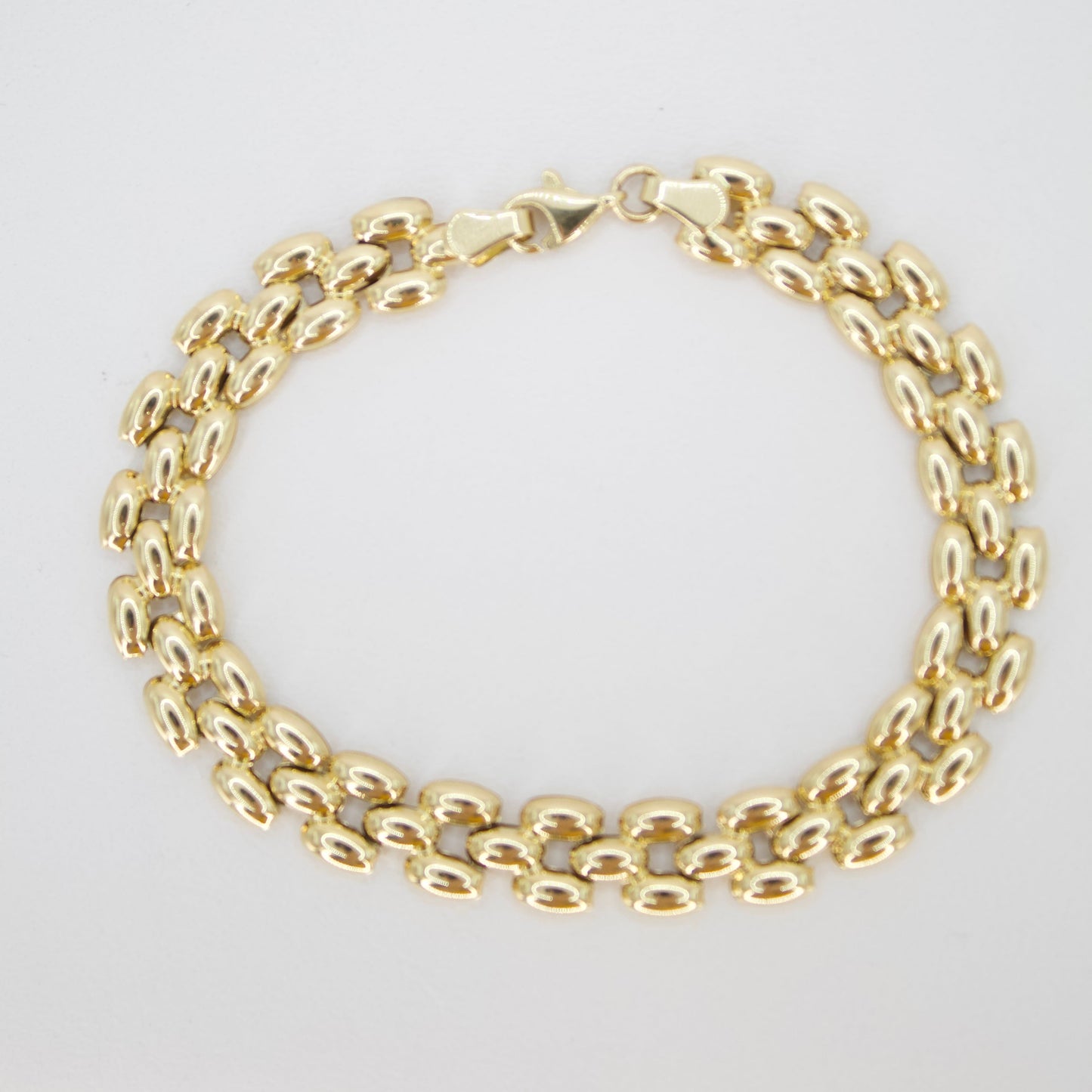 Pulsera tejido pantera en oro amarillo 14k.