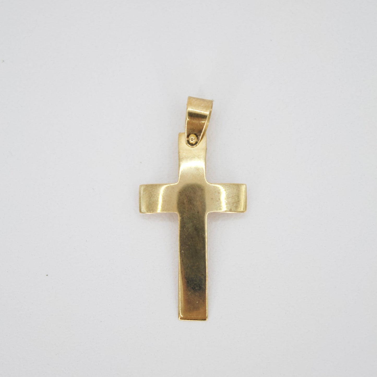 Cruz en oro amarillo 14k.