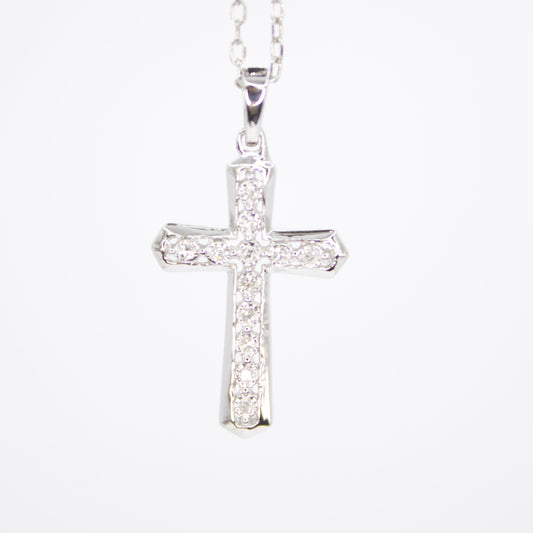 Cruz en oro blanco 14k con diamantes.